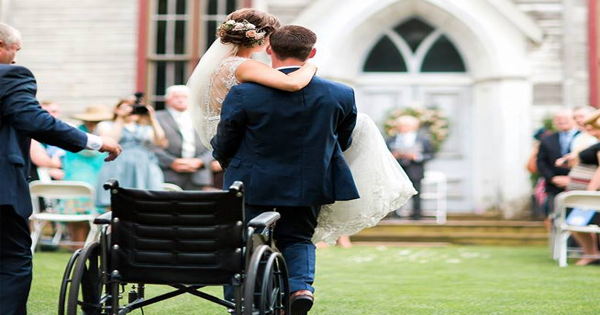 After A Car Crash Leaves Her Incapable Of Walking Down The Aisle, Her Groom Carries Her