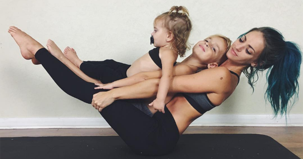 This Mother Finds The Most Adorable Way To Practice Yoga Even When Her Kids Won